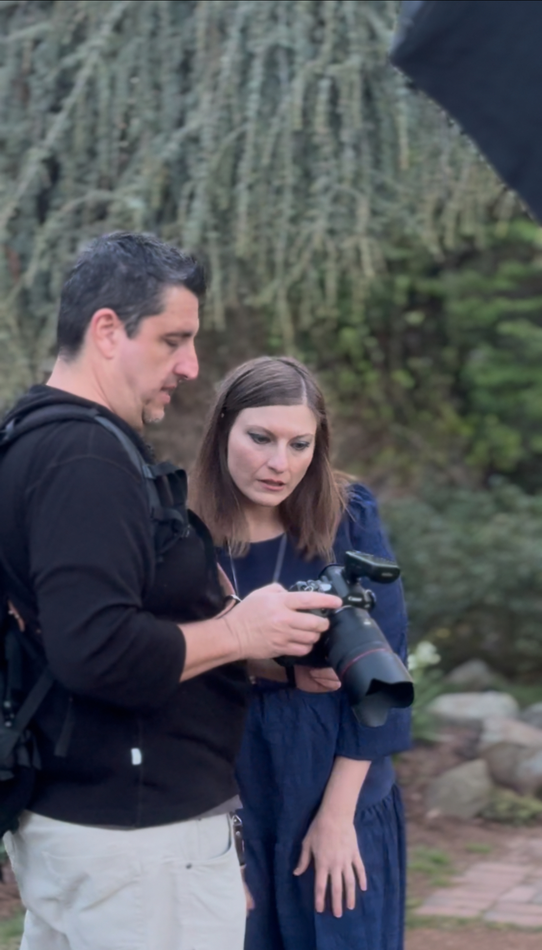 A practitioner reviewing an image with her photographer