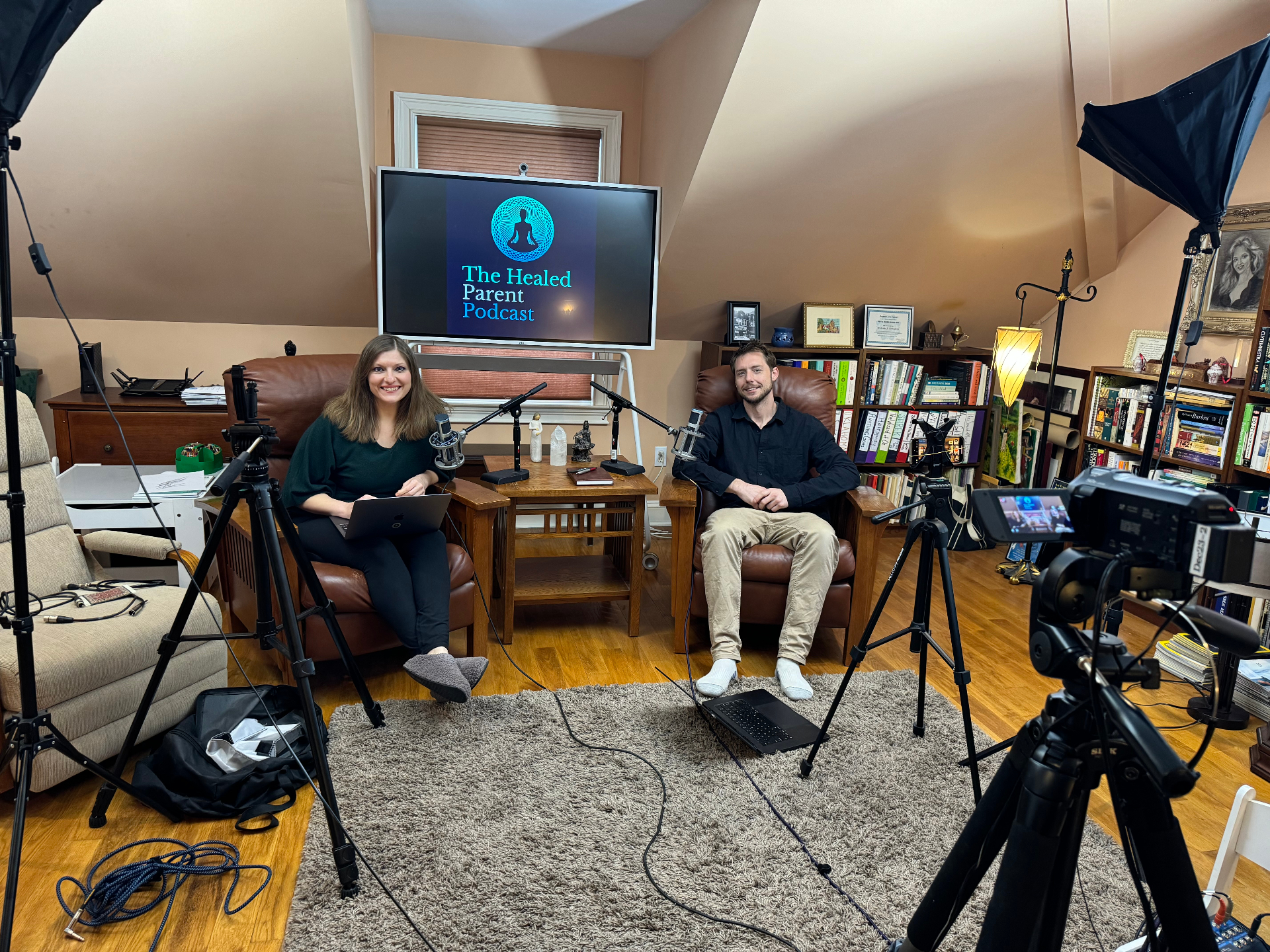 A practitioner recording a podcast conversation in her own room